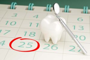歯が黒くなるのを予防するために定期歯科検診を受けるイメージ
